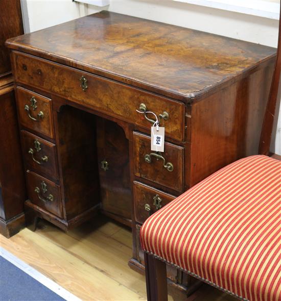 A George II walnut kneehole desk W.76cm